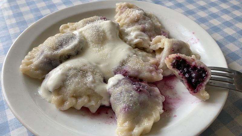 Pierogi z borówkami served in a Polish milk bar