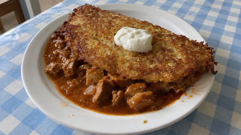 Placki po węgiersku served in a Polish milk bar